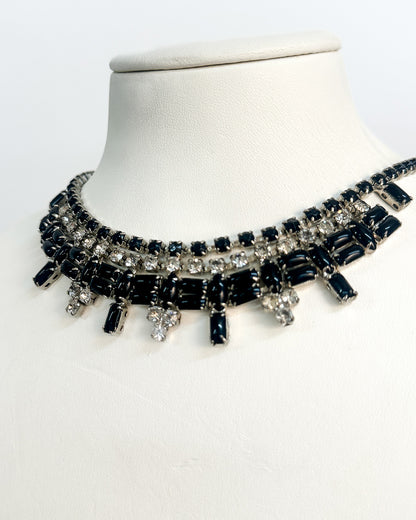 Necklace with black and clear stones on a white background