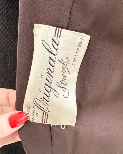 Close-up of a clothing label on a brown fabric background